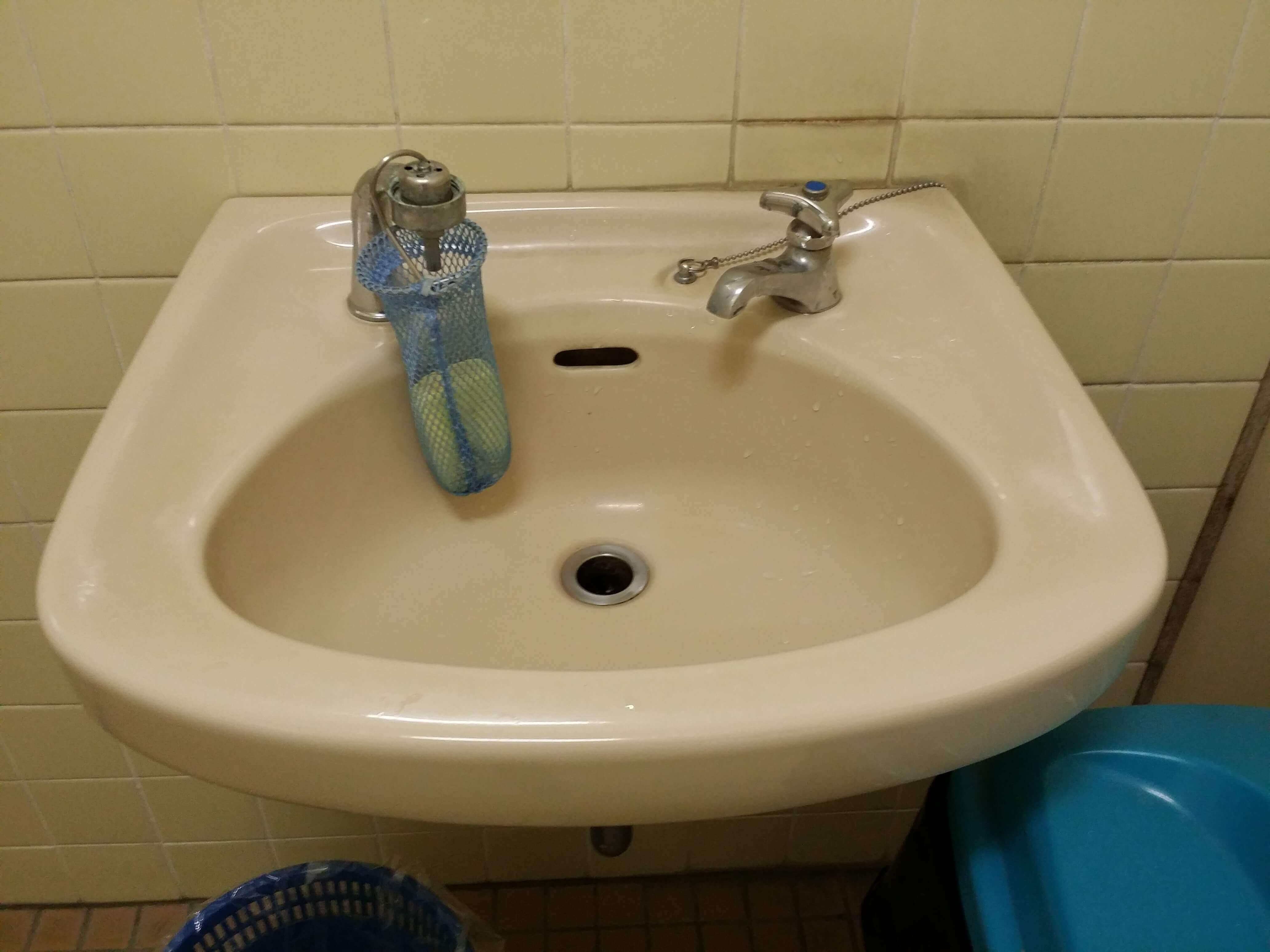 Living in Japan A bathroom sink with only a cold water nozzle.