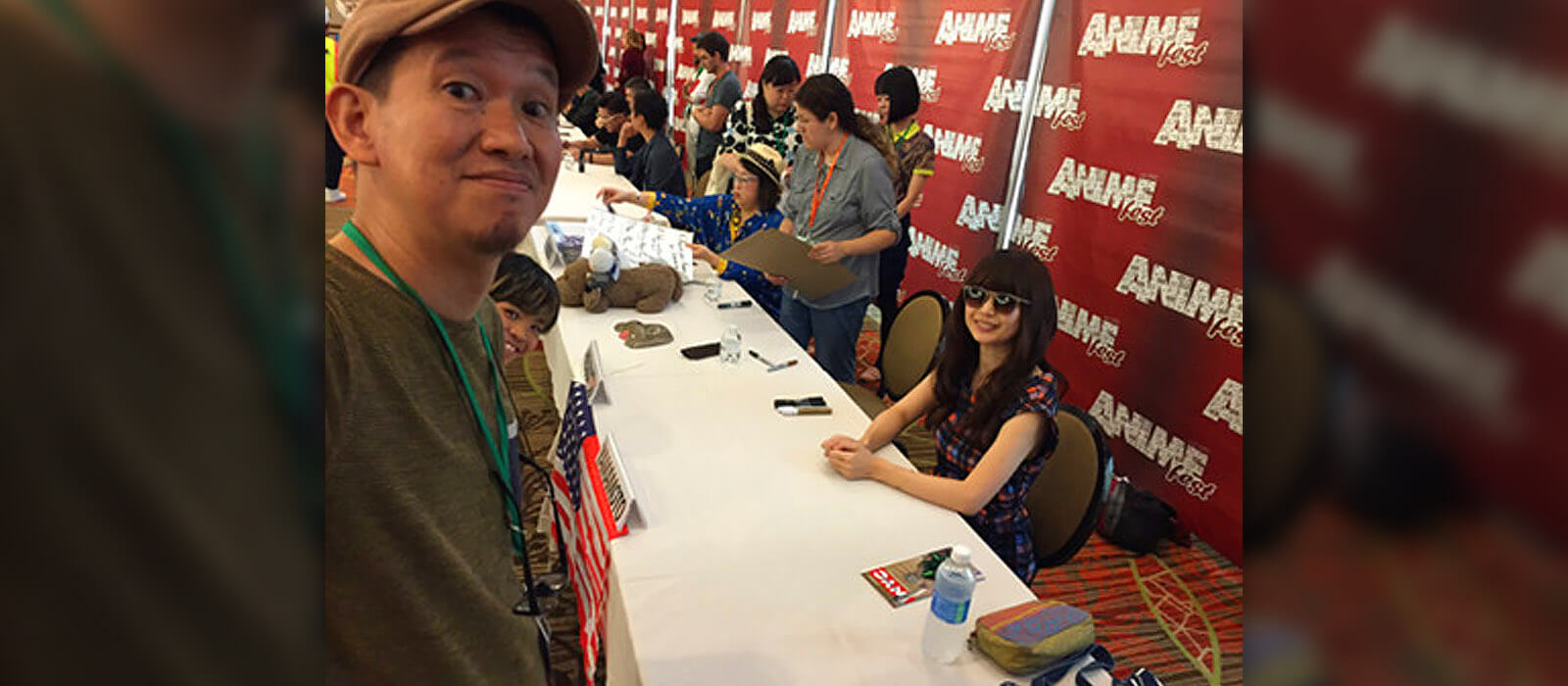 Hiramatsu taking a selfie with Yamamoto and Kubo during AnimeFest