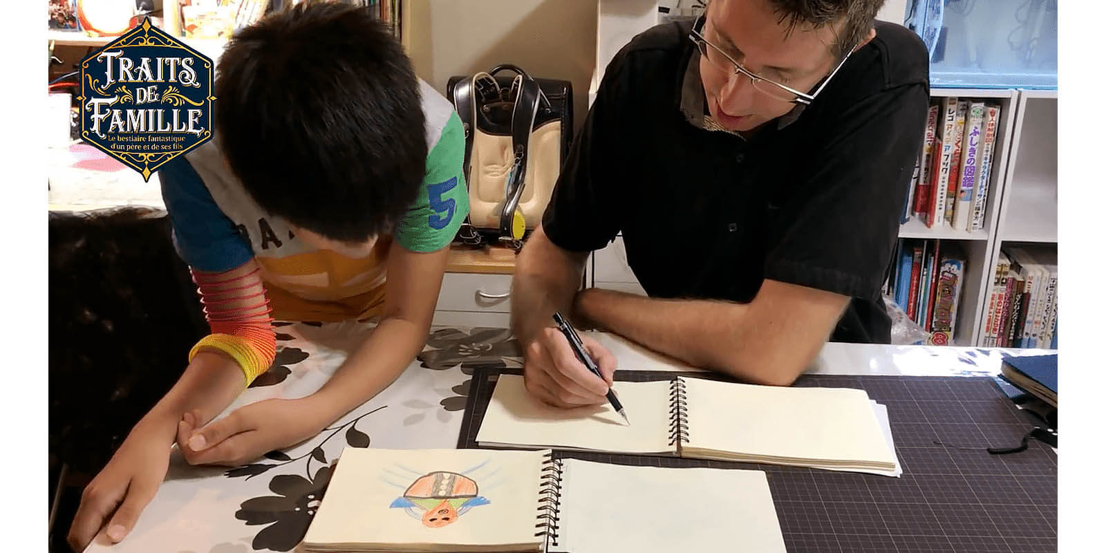 Thomas Romain re-creating his son’s drawing.