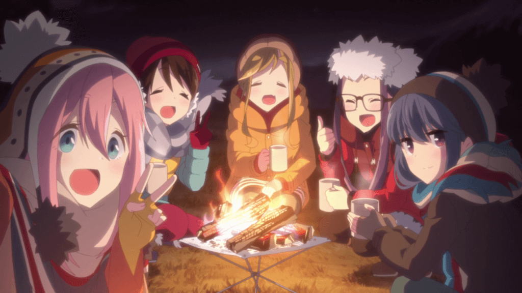 The main characters in front of a campfire
