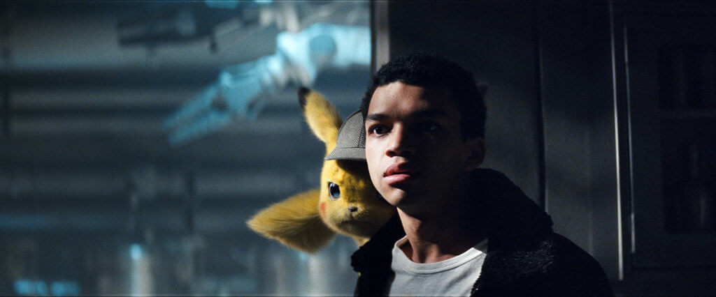 Pikachu sitting on Tim's shoulder