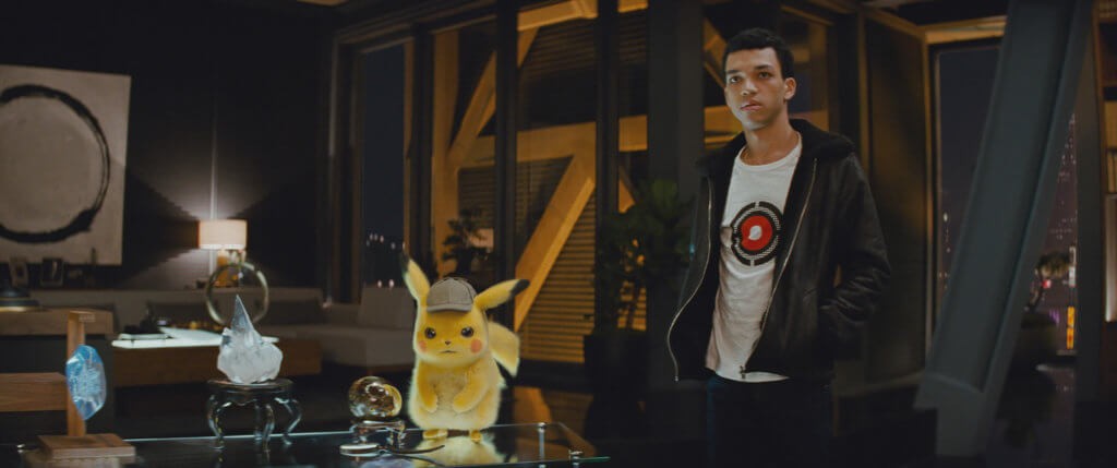 Pikachu looking angry while Tim looks casual