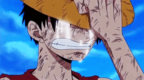 Luffy crying heavily with his hat pulled down over his eyes.
