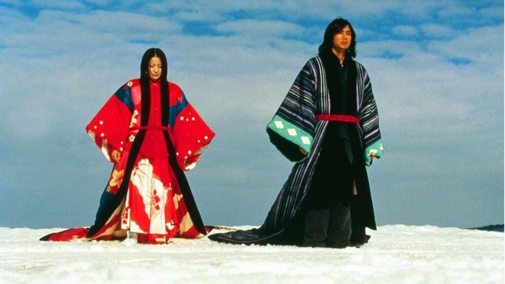 Sawako (Miho Kanno) and Matsumoto (Hidetoshi Nishijima) cross a snowy field