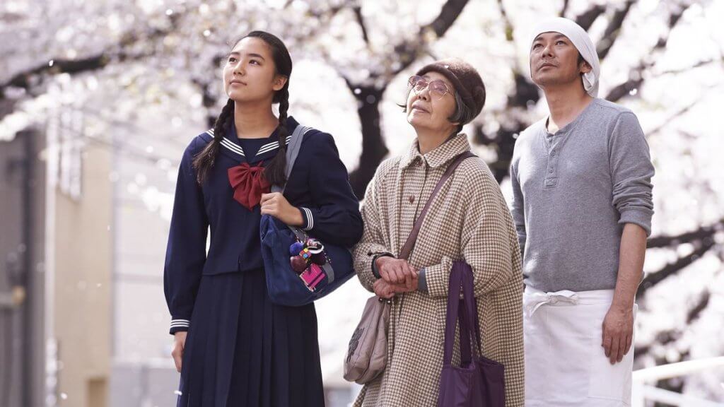 The main characters of Sweet Bean admire the sakura blossoms