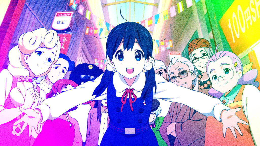 Tamako and the rest of the Tamako Market cast group together and smiling. Tamako is in the middle with her arms open in a welcoming manner.