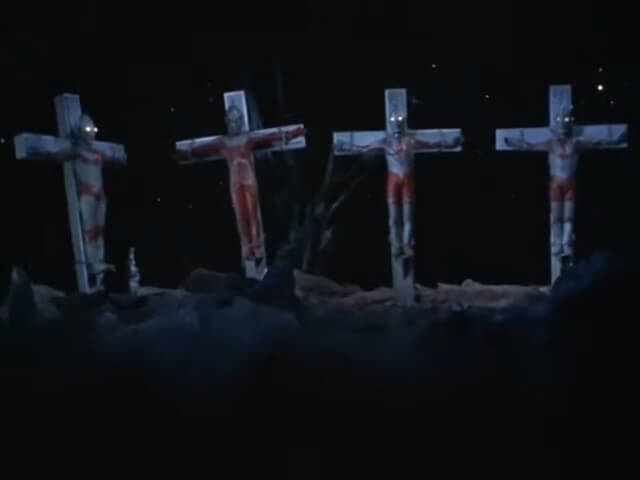 In an episode of ultraman ace, four "ultra brothers" are crucified in an anonymous wasteland. A few stars dot the darkness behind them, while stray brush sticks out from the dirt.