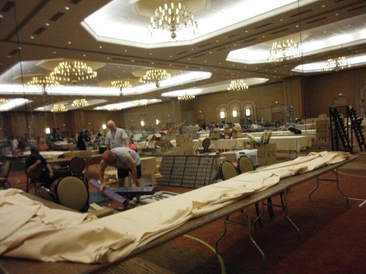 People in the process of dismantling the dealer's room booths in the Sheraton