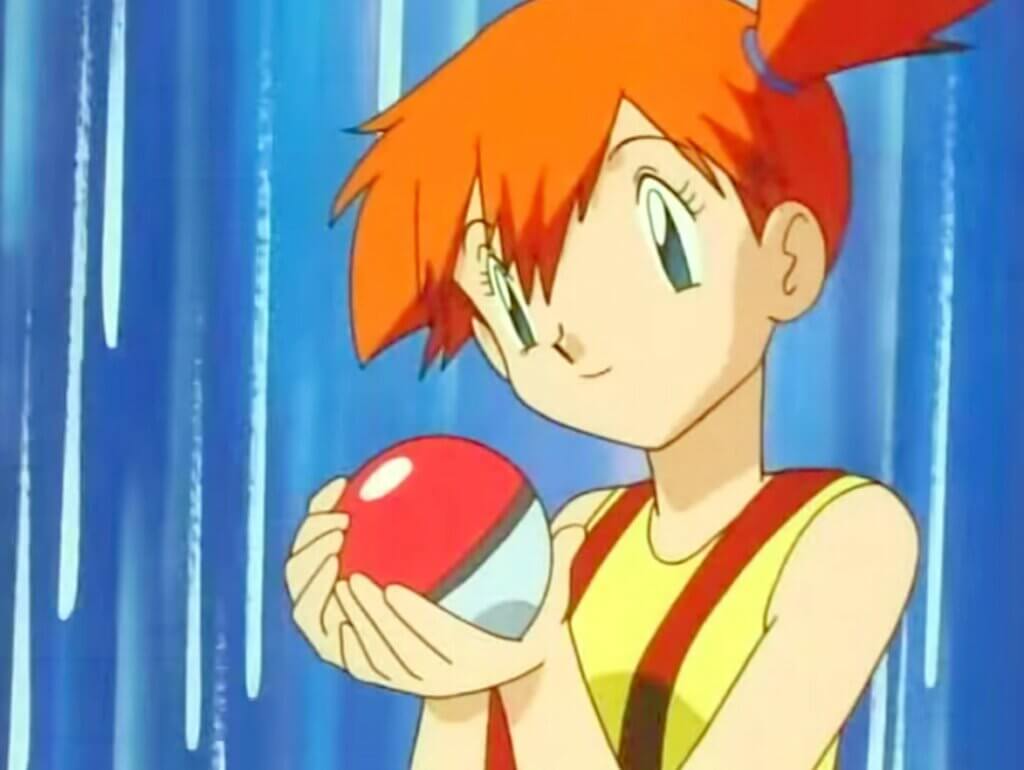 Misty holding a pokeball and smiling