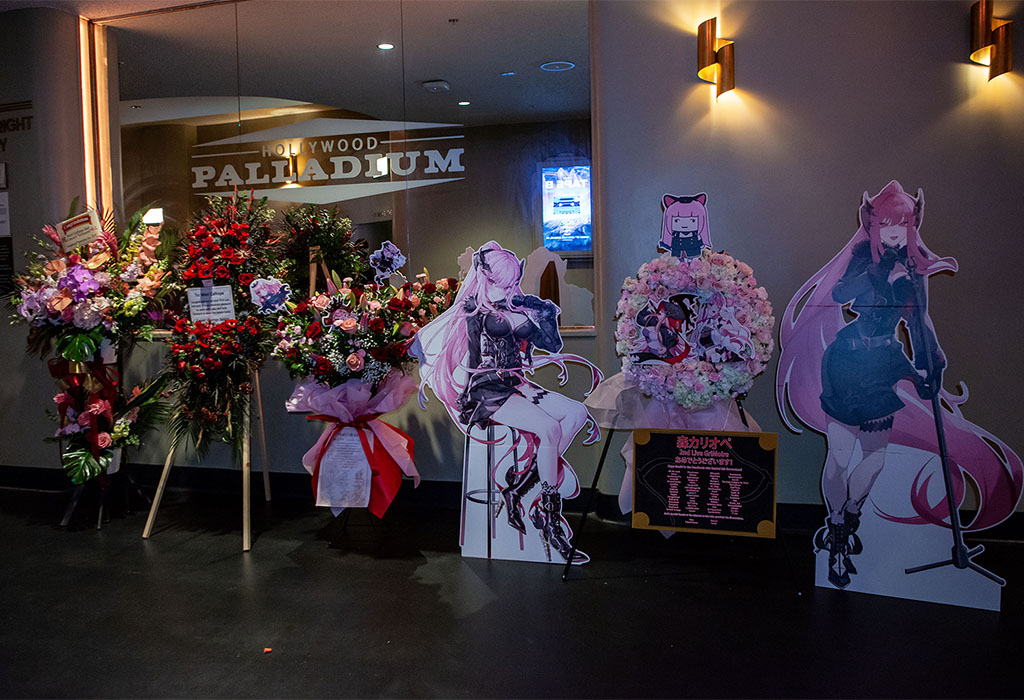 Flowers and cardboard standees congratulating Mori for her first concert