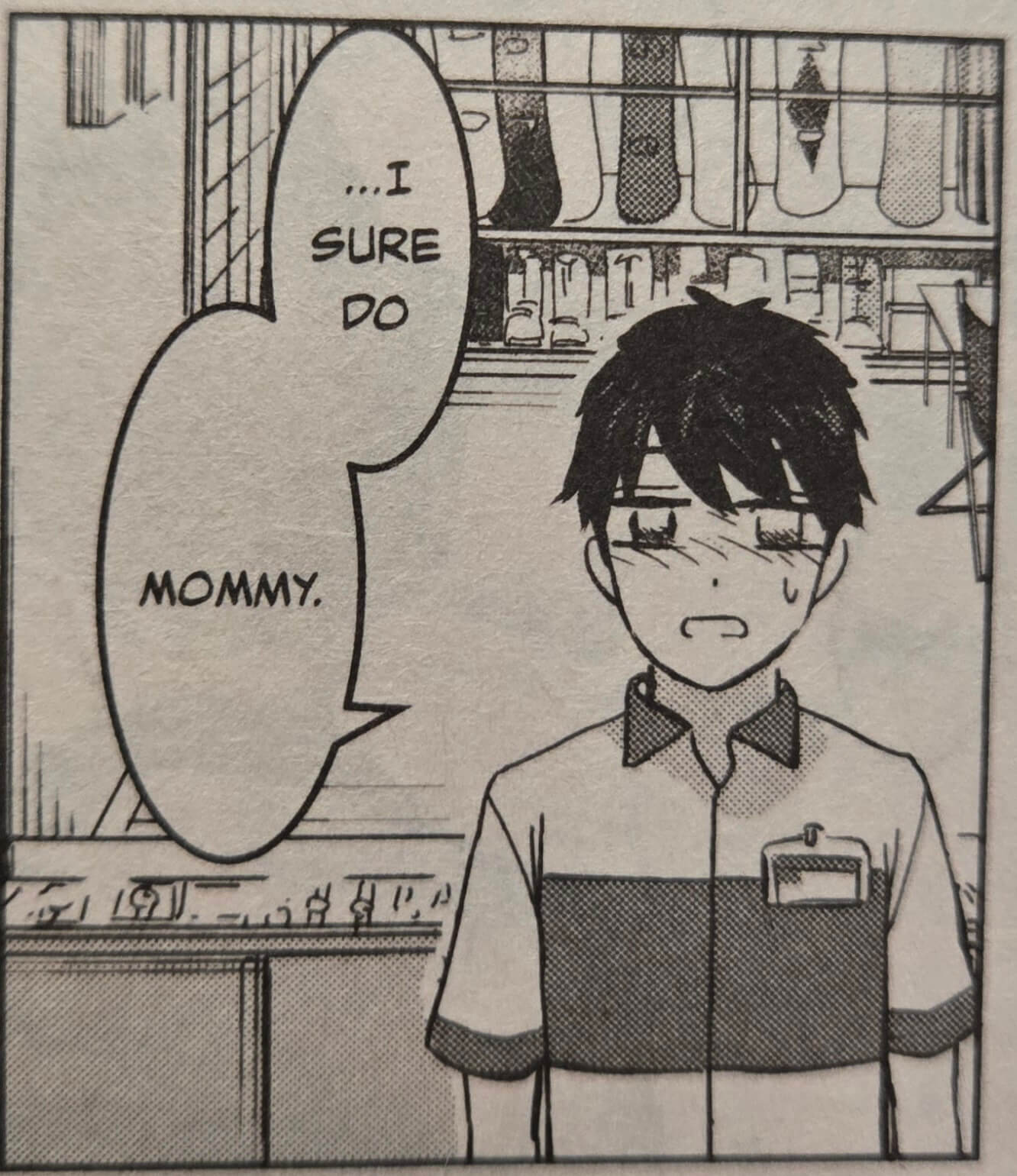 Ryo, a dark haired young man, stands in front of store shelves wearing a work shirt with a name tag pinned to it. A speech balloon says, “...I sure do mommy.”