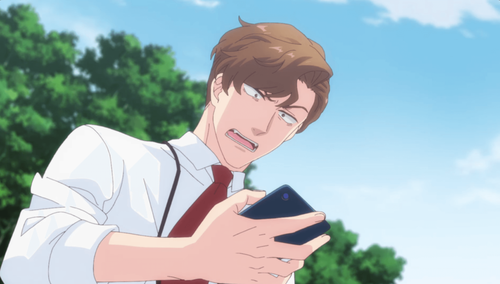 A handsome young man looking down angrily at his phone while yelling at it.