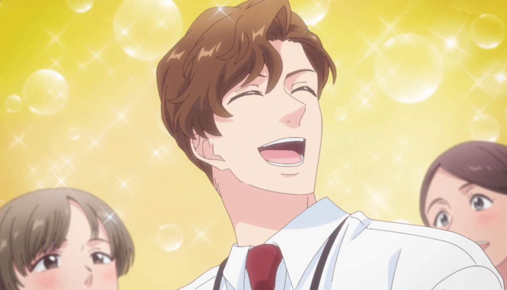 A very handsome man with brown hair flashes a winning smile at the women who work in the office with him as they stare in adoration. He seems to be surrounded by bubbles and sparkly light.