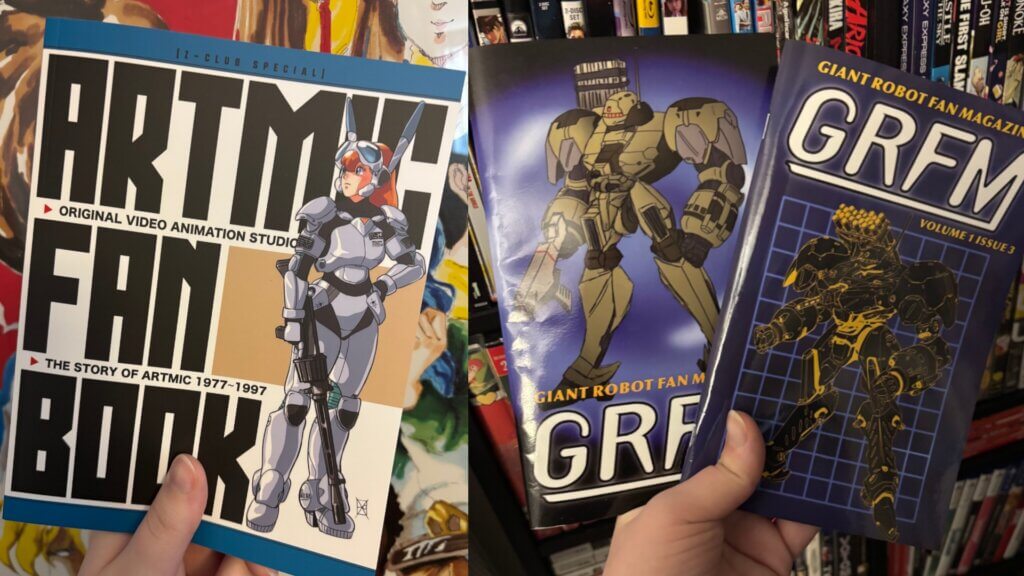 Two photos side by side of a hand holding up anime fan magazines. The magazine on the left features a woman wearing power armor with bunny ears; she is holding a gun. The magazine on the right features a giant robot with a missile launcher on its left shoulder; it is also holding a gun.