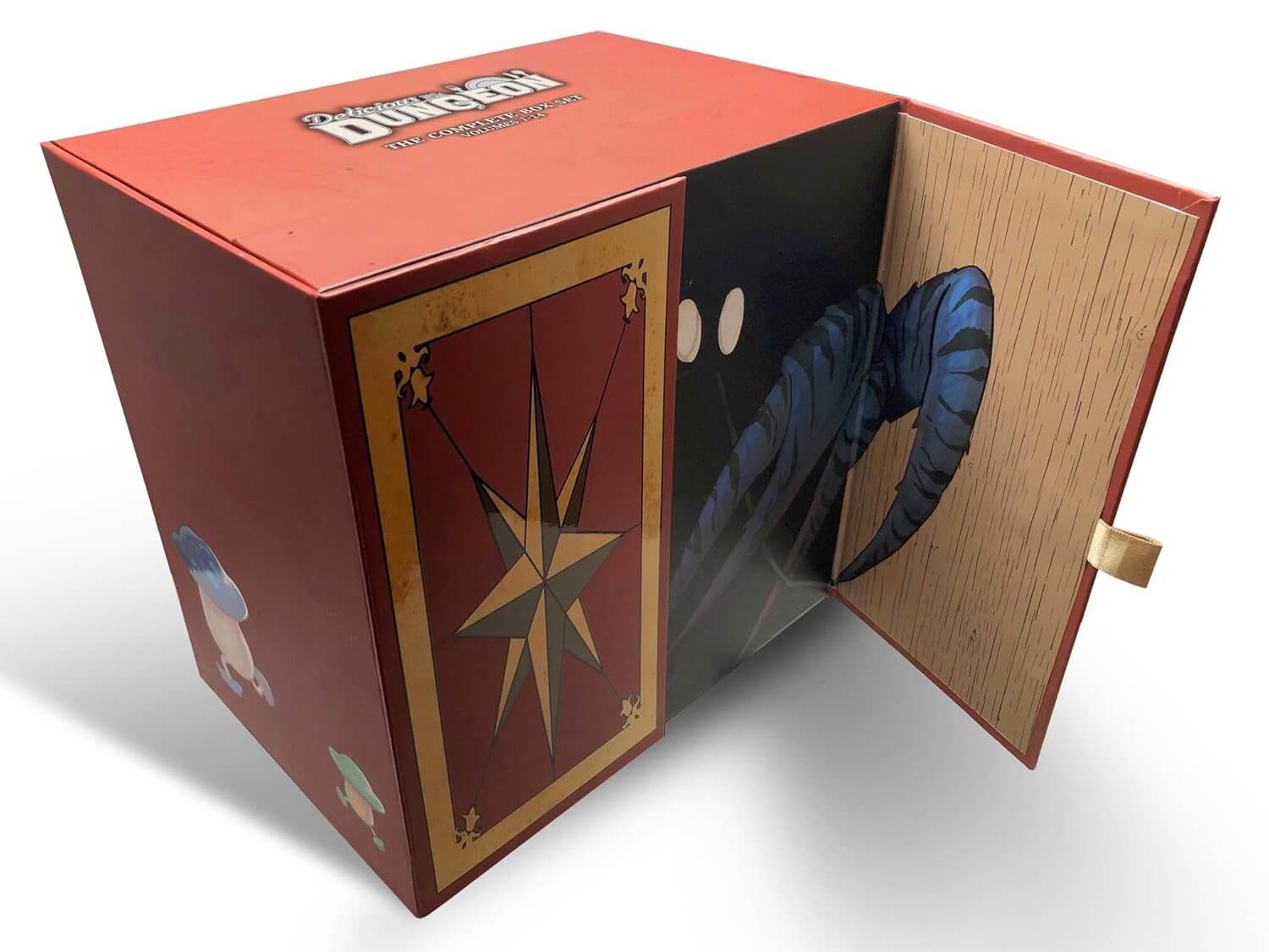 Delicious in Dungeon Boxset. A dark red box set that looks like a treasure chest. It is decorated with walking mushrooms. The false doors on display open slightly to reveal the blue crustacean claws and white glowing eyes of a mimic.