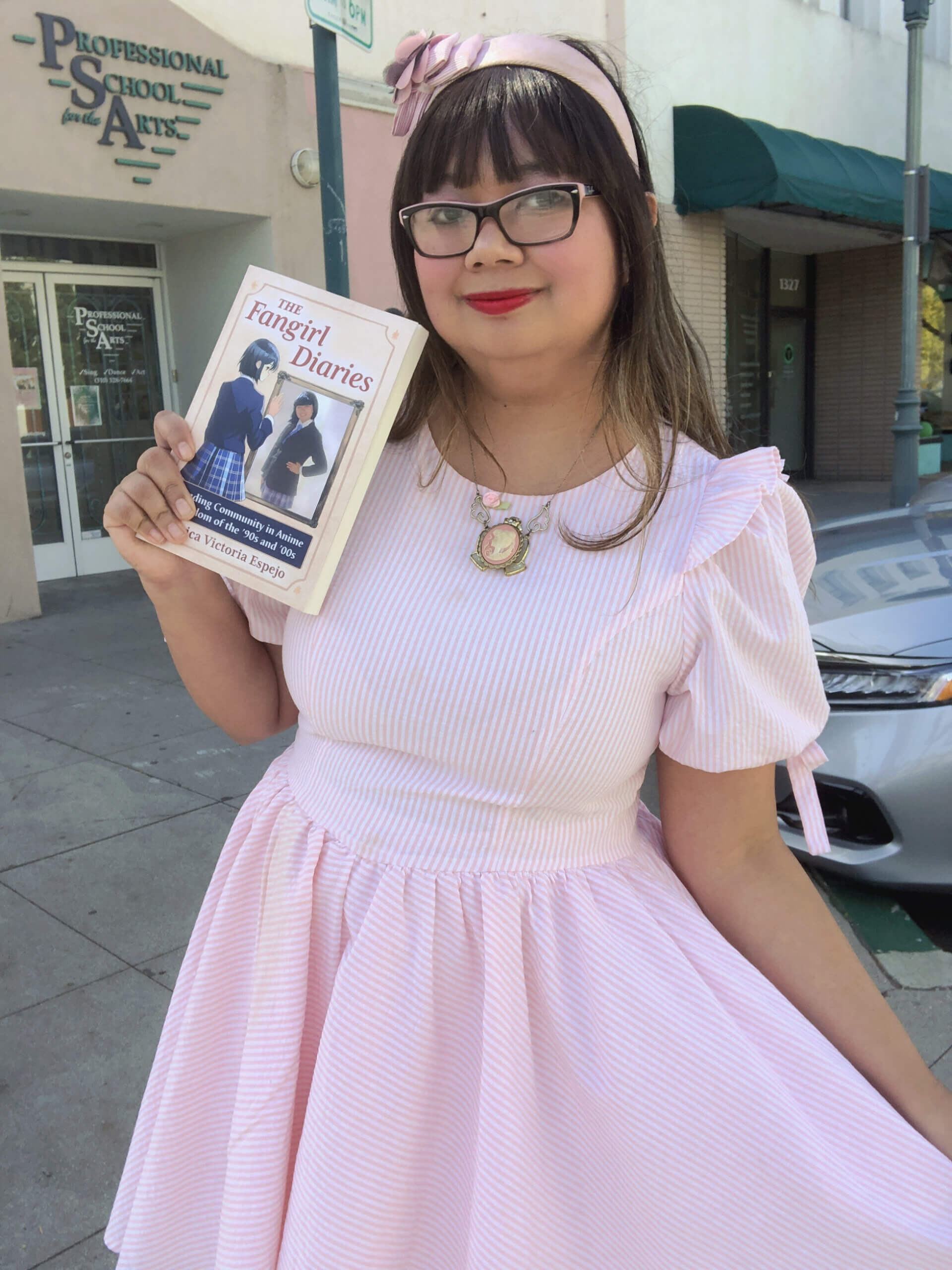 Eri Victoria with a copy of The Fangirl Diaries. Image via Eri Victoria