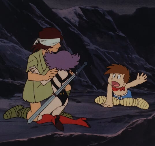 An anime screenshot of Bunretsu, a small child with brown hair, blue shorts, and a red scarf with no shirt on, exclaims with one hand up in the air to Gai, a man with a bandage over one eye, and Emiya/Prime Rose, a woman with light purple hair, a black bikini, and red knee-high boots on. Gai and Emiya/Prime Rose are kneeling on the ground and holding each other, their backs to the viewer.