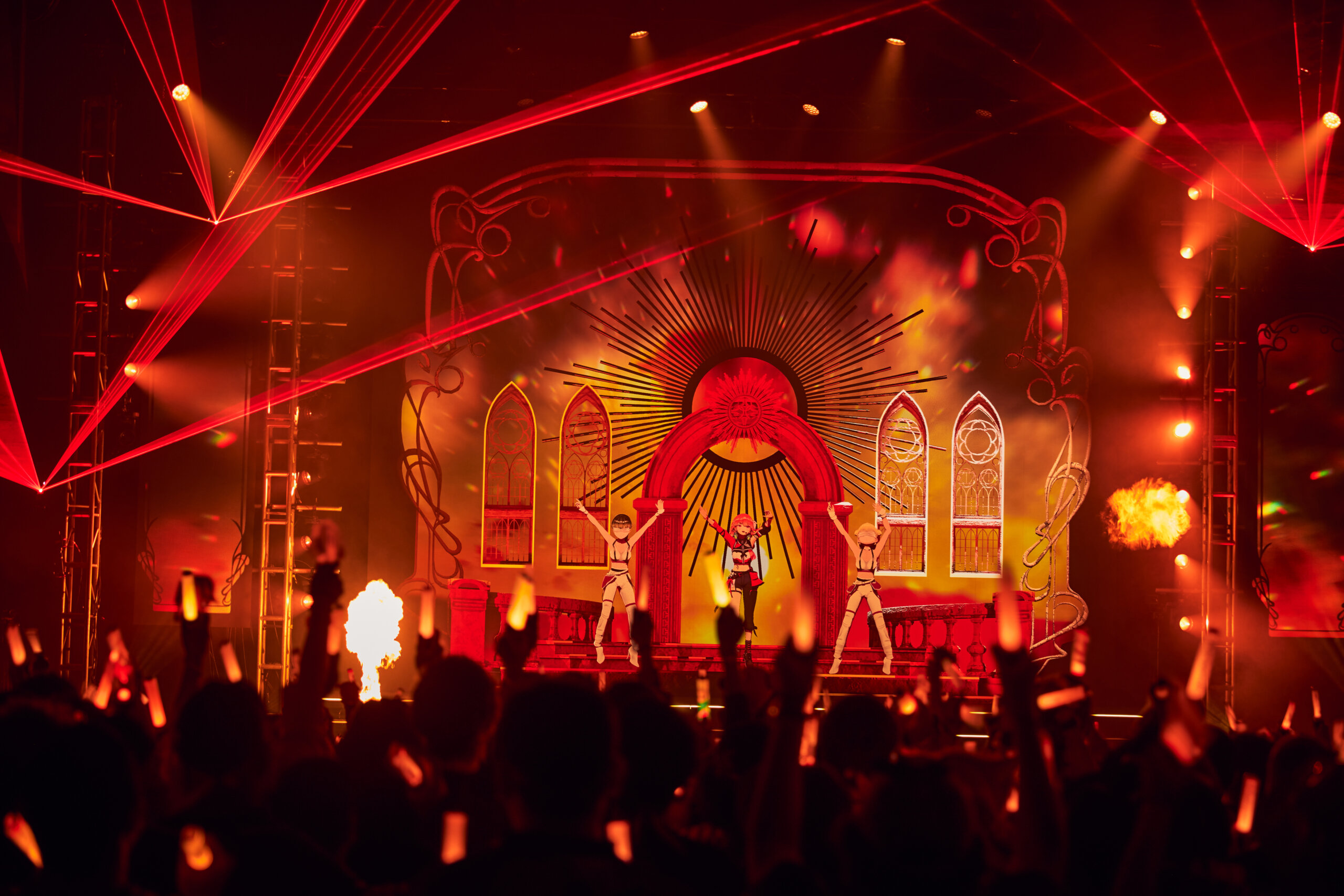 Kiara Takanashi performing in front of the audience with backup dancers on each side