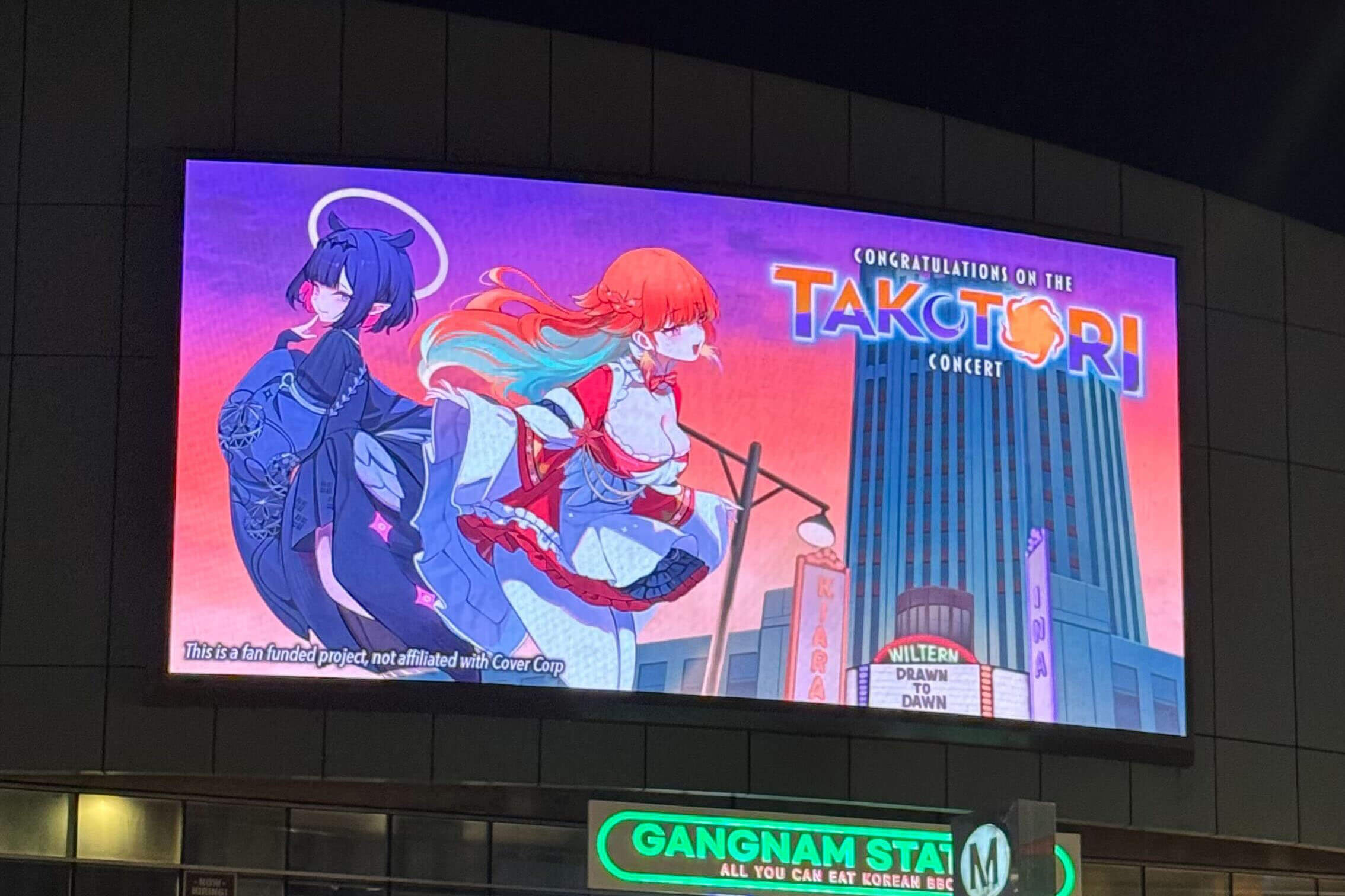 Electronic signage on the venue congratulating Taku Tori for their concert