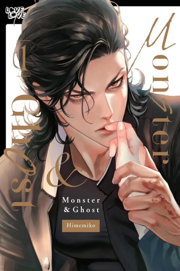 The cover of Monster & Ghost by Himemiko featuring the character Tsubaki kissing the fingers on a ghostly hand while staring intently. Tsubaki is a young man with long black hair that is brushed away from his face, and is dressed in a black gakuran-style uniform that is open to show his buff chest. 