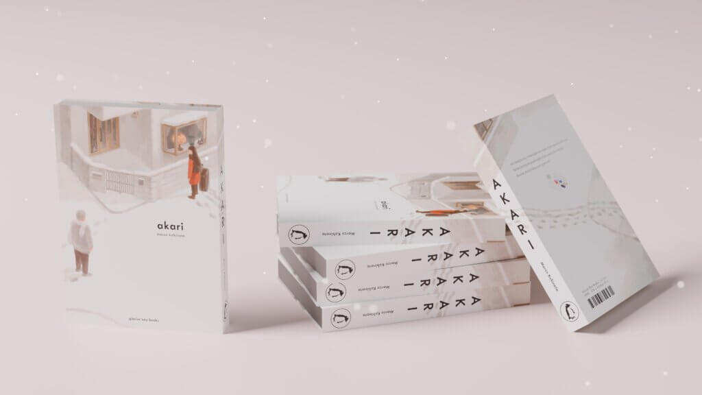 A physical edition of the manga akari, next to a stack of volumes. The cover depicts a man and a woman facing each other on a snowy street corner.