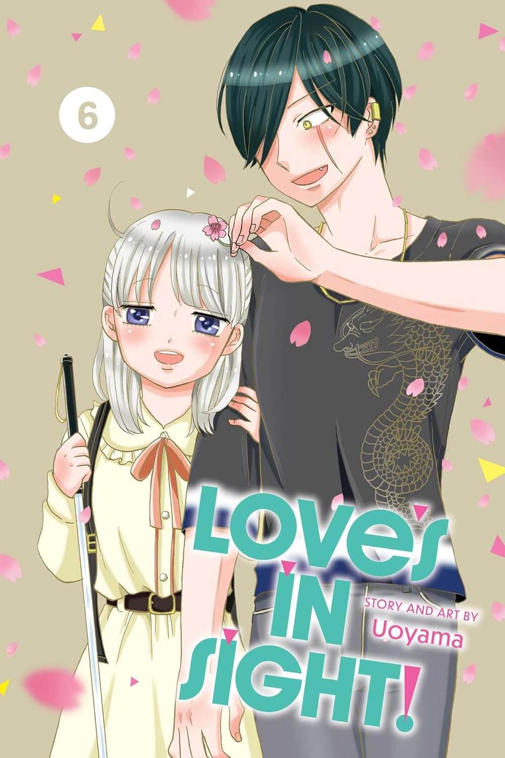 Cover for Volume 6 of Love’s In Sight! By Uoyama. A teenage boy in a black T-shirt with a chinese dragon motif picks sakura flowers out of his girlfriend’s hair. The girl is clinging to his arm as he guides her while her other hand holds her cane. He has black hair and a large scar that runs down the right side of his face. She has silver hair, large unfocused eyes, and a cute yellow dress with a brown bow. The two look absolutely besotted with each other.