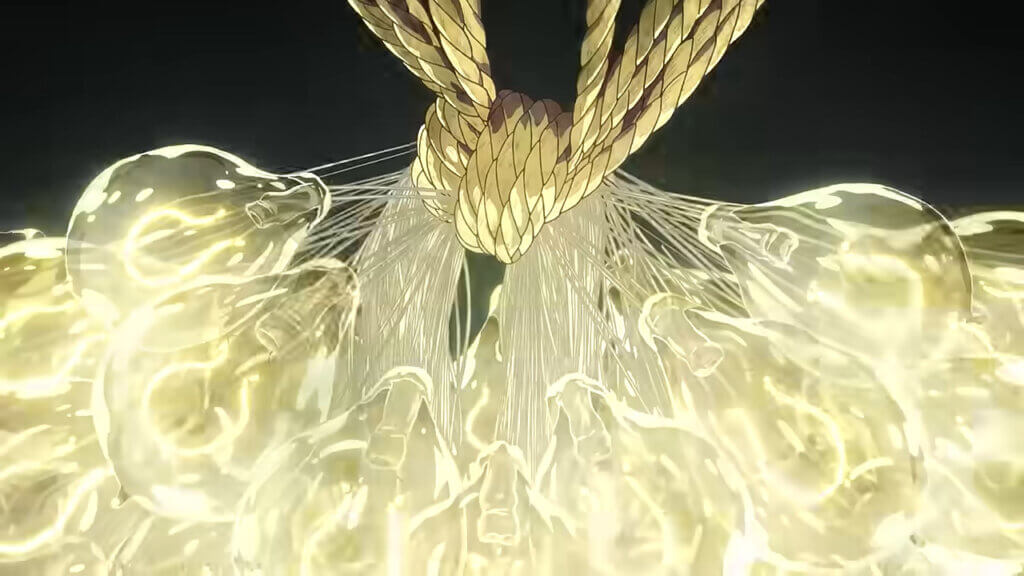 A cluster of electric lightbulbs tied together by rope.