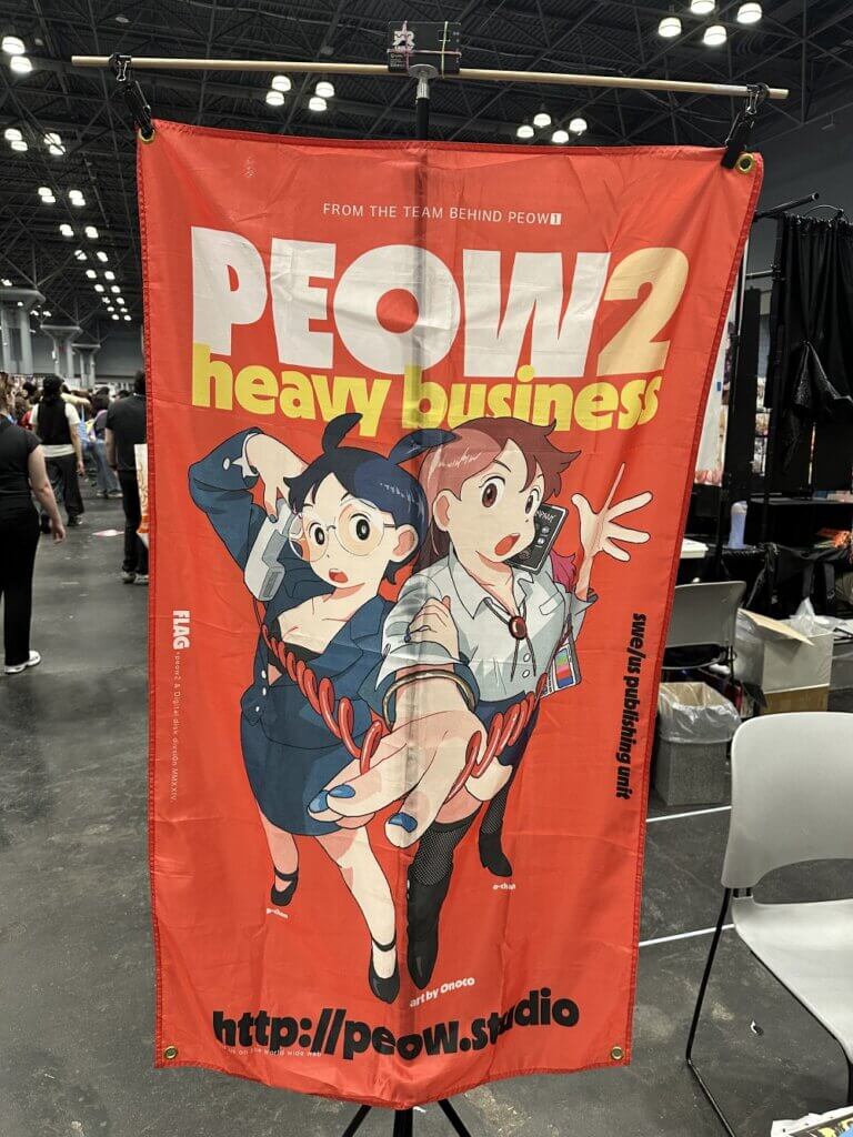 A banner advertising the independent publisher PEOW 2, featuring two women wearing office appropriate clothing. The woman on the left is holding a phone while the woman on the right is pulling the phone’s cord towards the viewer. The banner reads, “From the team behind PEOW 1.”